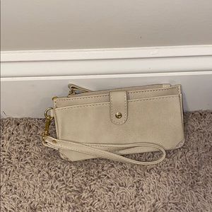 A cream wristlet